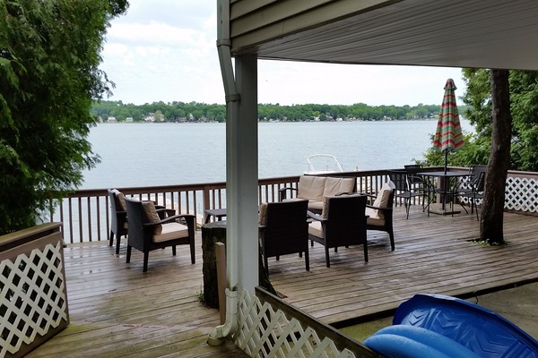 Deck has two outdoor sets that seat 8 plus an umbrella table with 4 additional