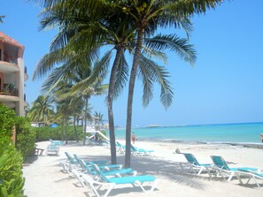 On the beach, sun loungers, beach towels