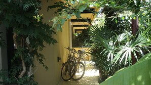 A narrow pathway leading to a yellow building with a bicycle parked outside. - Italy, Tuscany, Versilia, Cinquale 400 meters from the sea and 3km from Forte dei Marmi (Capanne-Prato-Cinquale)