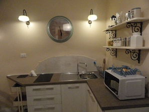 Fridge, microwave, stovetop, coffee/tea maker