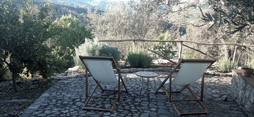 Casa del Vento in San Cono, ancient stone dwelling among olive trees