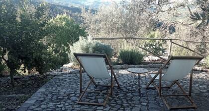 Casa del Vento in San Cono, ancient stone dwelling among olive trees