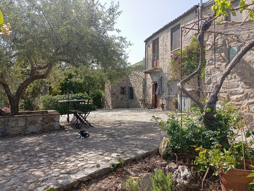Casa del Vento in San Cono, ancient stone dwelling among olive trees
