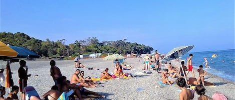 On the beach, sun loungers