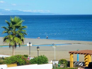 On the beach, sun-loungers
