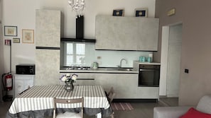 Enjoy meals in the kitchen with a stove and oven, and take in the city view from the large window.