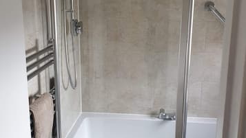 Combined shower/tub, hair dryer, towels, soap