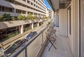 Enjoy a balcony with a table and chairs, offering a view of the city.