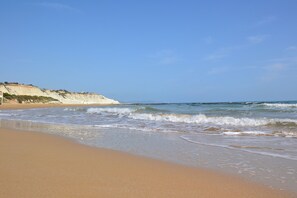On the beach, sun-loungers