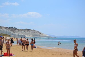 On the beach, sun-loungers