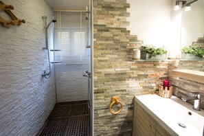 Shower, hair dryer, towels, toilet paper