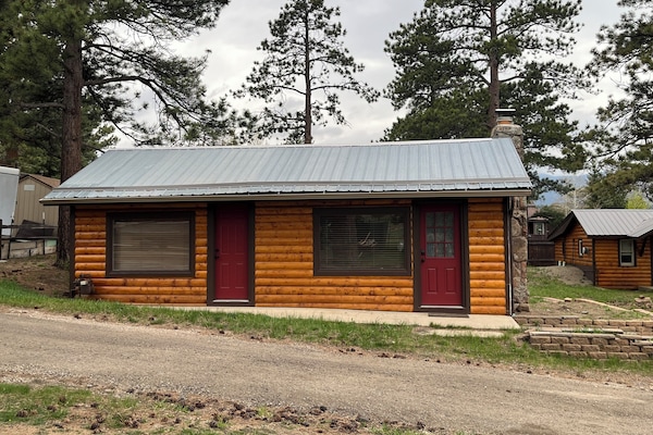 Two adorable cabins for the price of one. Second cabin in background on right.
