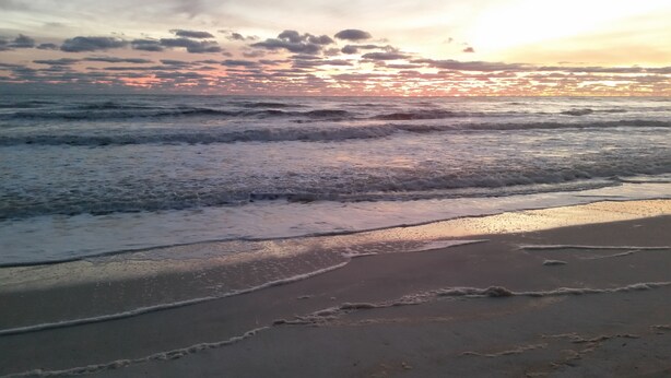A beach with waves and a sunset. - On 30A Water lovers dream!! 4 gorgeous pools, Lake and Ocean . Pet Friendly (Panama City Beach)