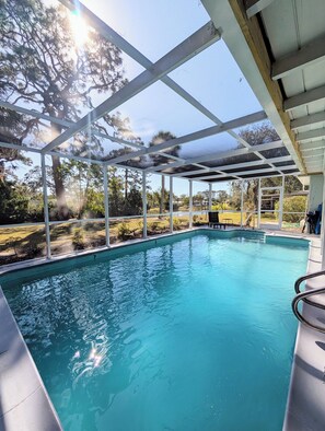 Outdoor pool, a heated pool - Relaxing Lakefront Home: 3BR/2BA, Heated Pool, Near Siesta Key Beach (SARASOTA)