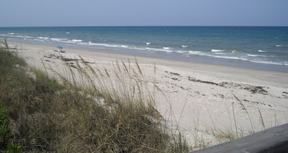 Beach-side updated pool home with a 4 min walk to the beach.