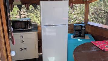 Fridge, coffee/tea maker, toaster, cookware/dishes/utensils