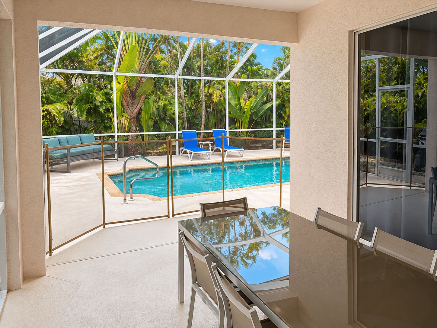 South facing lanai dining area seats 6, Weber grill, removable child safety gate