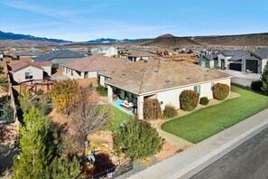 Homes with pitched roofs and well-manicured lawns line the streets.