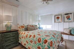 A bedroom with a bed, dresser, and bedside lamps. - Located In the Heart of Mission Beach! (San Diego)