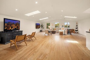 Smart TV, fireplace, video game console, table football