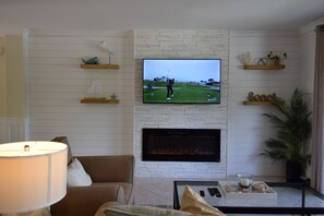 Smart TV, fireplace, DVD player, books