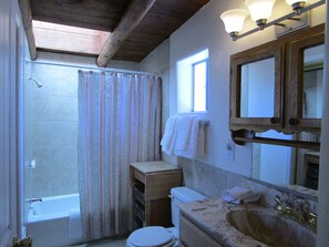 Combined shower/tub, hair dryer, towels, soap