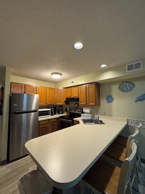 Fridge, microwave, oven, stovetop