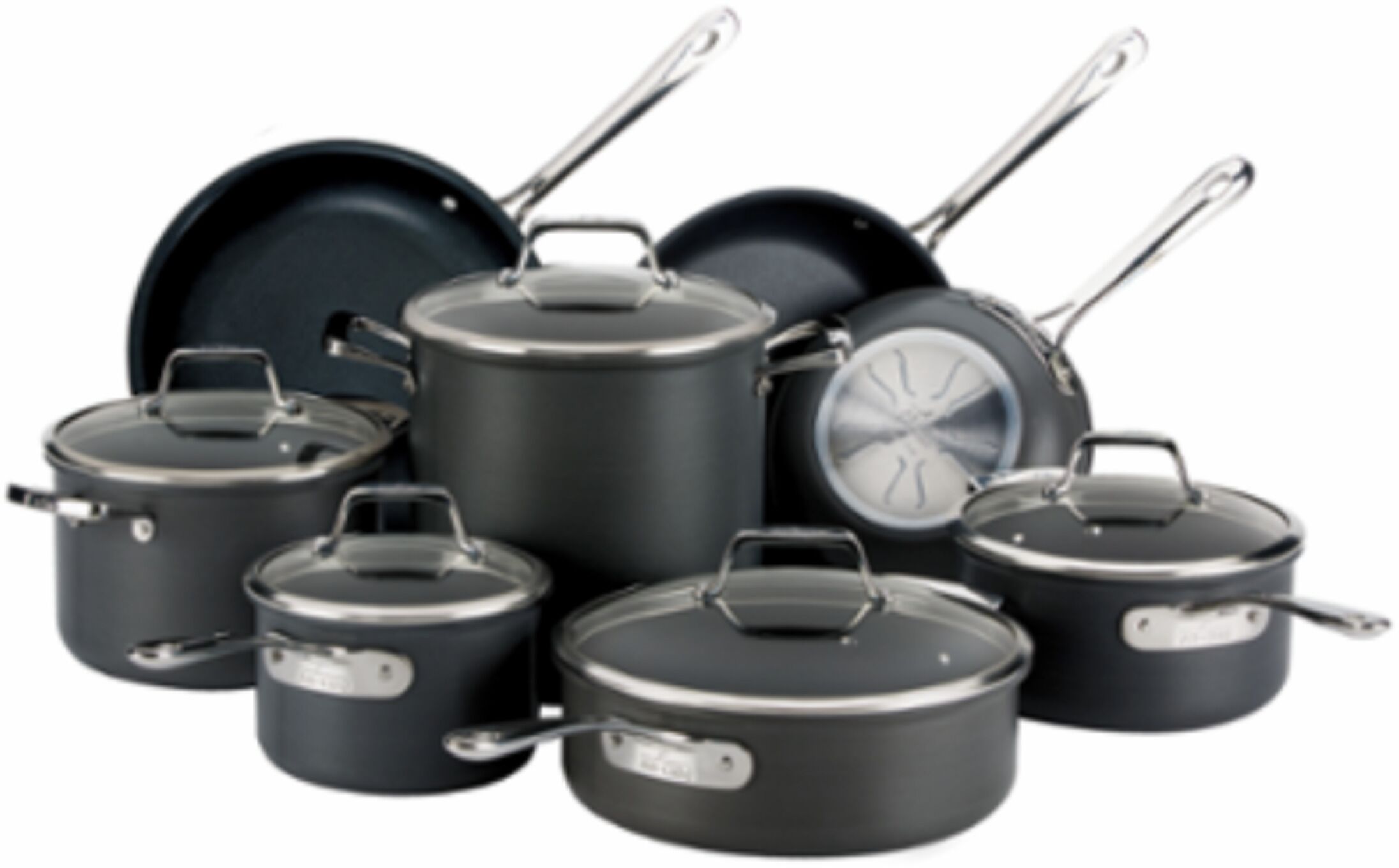 A collection of black cookware with lids and handles.