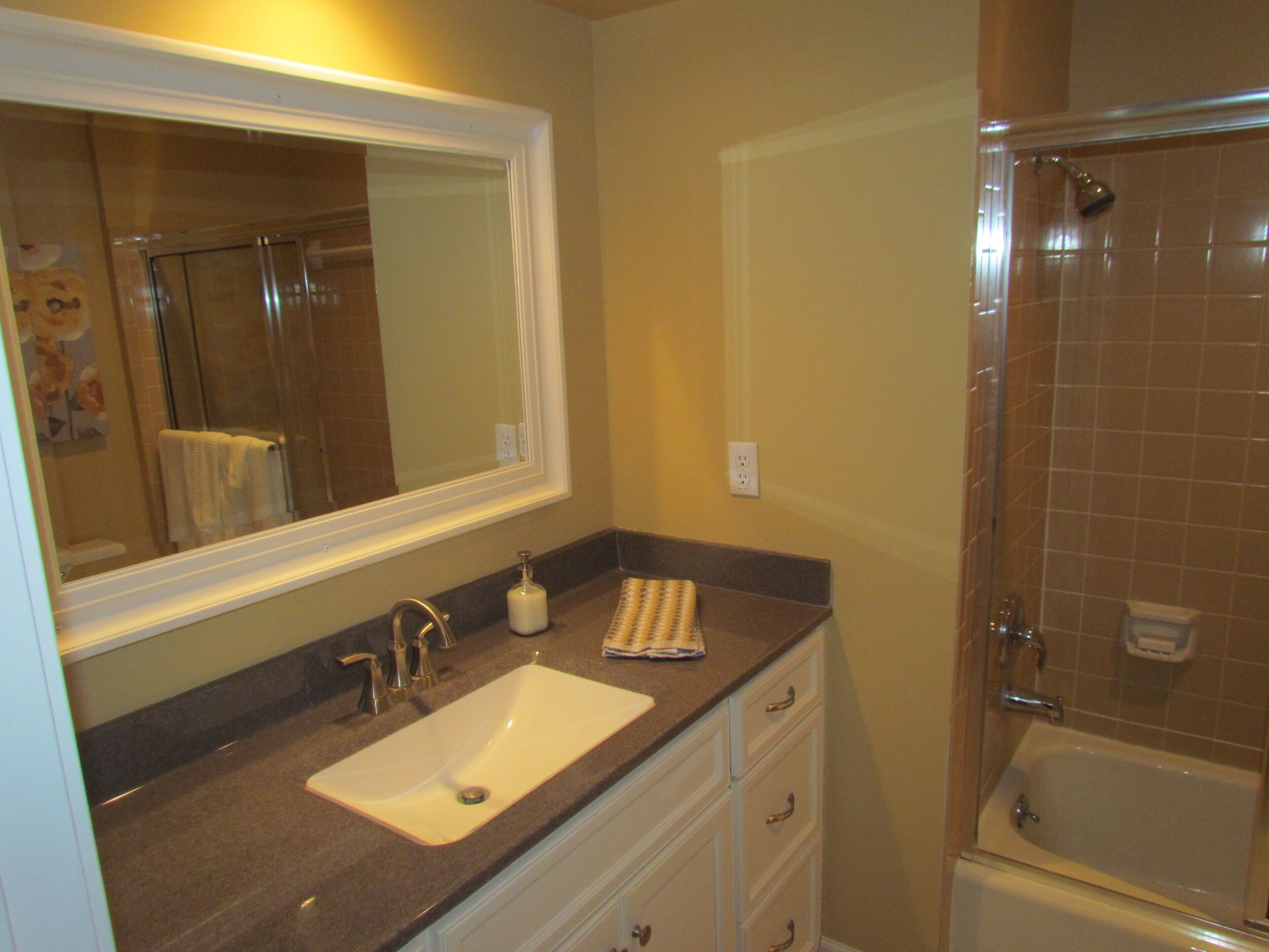 Combined shower/tub, hair dryer, towels, soap