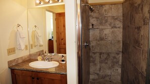 Combined shower/bathtub, hair dryer, towels, soap