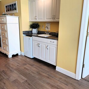 Enjoy cooking in this well-equipped kitchen with a sink and ample countertop space.