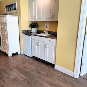Enjoy cooking in this well-equipped kitchen with a sink and ample countertop space.