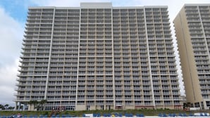 A high-rise building with multiple balconies and a uniform architectural style. - TOP FLOOR, GREAT VIEW, FRIENDLY PRICES! (Panama City Beach)