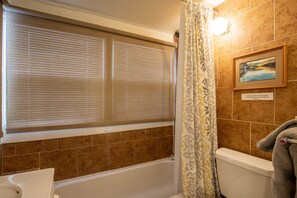 Combined shower/bathtub, hair dryer, towels, soap