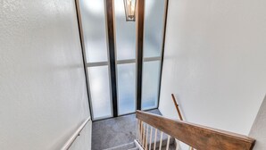A staircase with a wooden handrail and a frosted glass door at the top. - Large Townhouse, 3Bd/3Ba, Near BYU Stadium/BYU  (Provo)