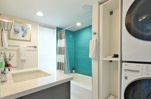 Combined shower/bathtub, hair dryer, towels, soap