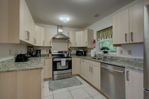 Enjoy cooking in this well-equipped kitchen with a gas stove, oven, and dishwasher.