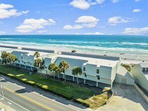 Enjoy ocean views from this beachfront hotel with flat roof design.