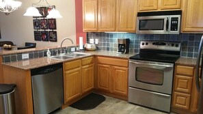 Fridge, microwave, oven, stovetop - Luxury Riverfront Condo in Perfect Location near Tanger Outlets (Sevierville)
