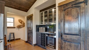 A kitchen with wooden cabinets, a stainless steel refrigerator, and a dishwasher. - 20 acres private ranch with Mountain View’s  (Bend)