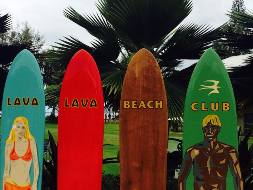 Four surfboards with labels: 'Lava', 'Lava', 'Beach', and 'Club'.