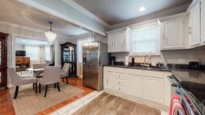Enjoy cooking in this well-equipped kitchen with a refrigerator, stove, and oven.