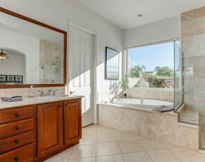 Bathtub, hair dryer, towels, soap
