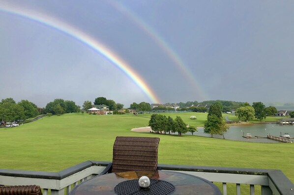 A view from a balcony overlooking a golf course with a rainbow in the sky. - BEST FALL COLORS VIEWS@BERNARDS LANDING - BOOK NOW (Moneta)
