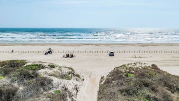 On the beach, sun loungers, beach towels