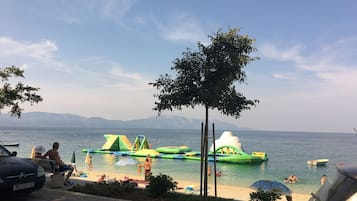 On the beach, sun loungers, beach towels