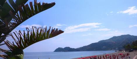 On the beach, sun loungers, beach towels