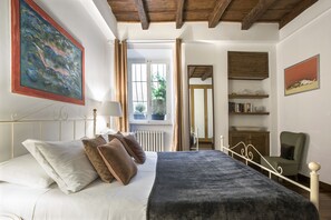 1 bedroom, desk, iron/ironing board, travel crib