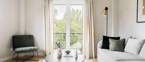 Apartment, 2 Bedrooms | Living area | 43-inch Smart TV with satellite channels, TV, Netflix