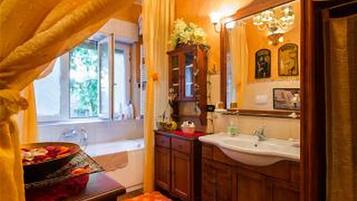 Combined shower/tub, hair dryer, slippers, bidet